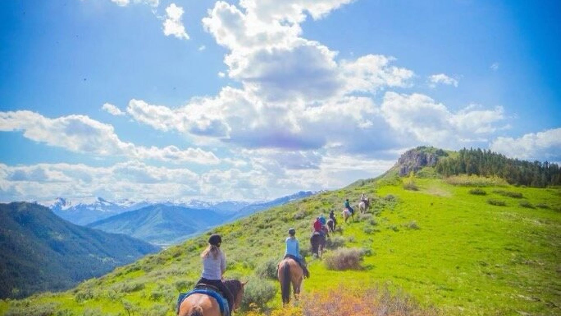 Horseback trail ride up the Teton Range at the Mill Iron Ranch in Jackson Hole WY